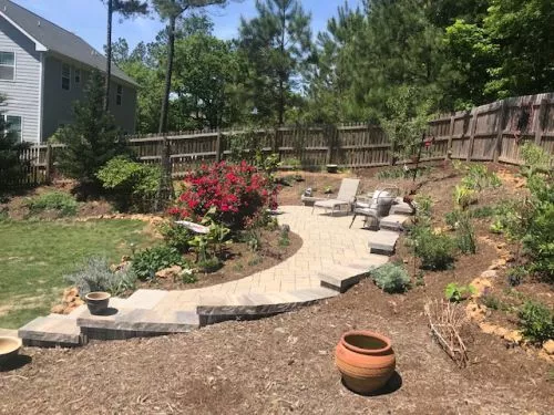 We love our new pond! Paige and her team created a beautiful focal point for our backyard garden, including a waterfall and