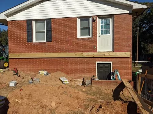 Safeguard Fencing removed an over grown hedge prior to installing a backyard privacy fence