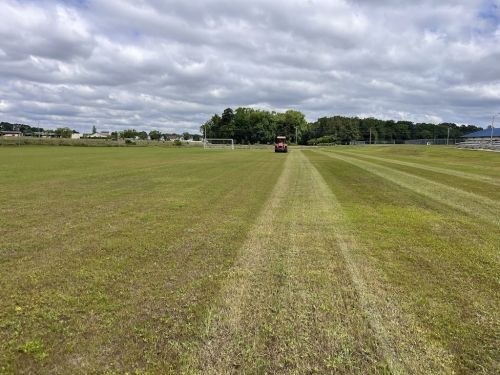  alt='Our lawn looks awesome. Crew was meticulous in evenly applying pine straw. Application followed the curving borders'